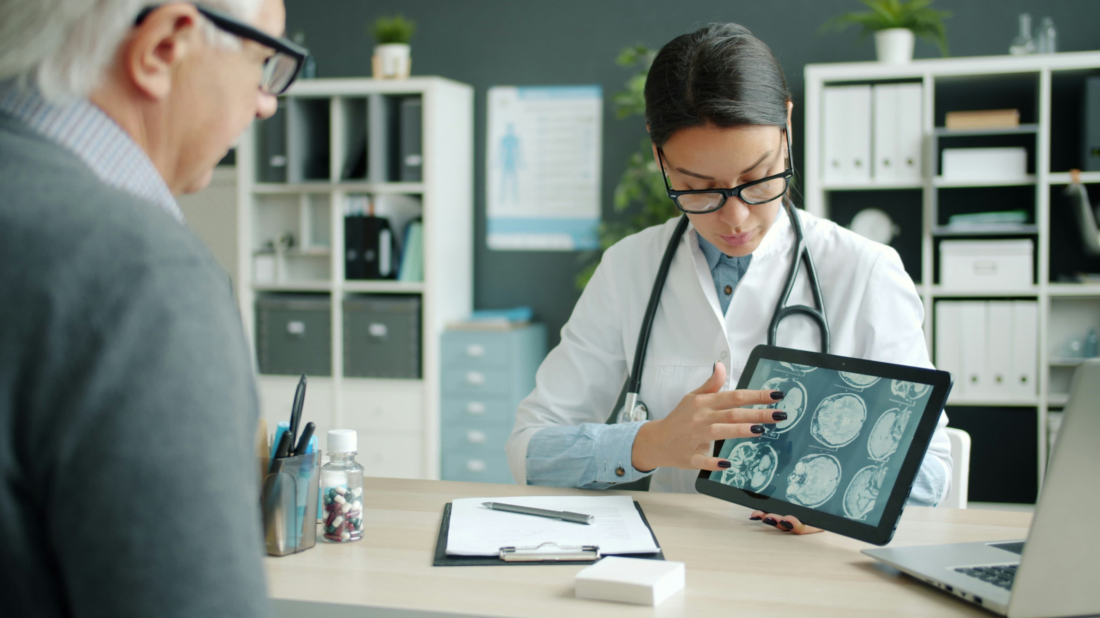 Clinician reviewing AI-assisted medical imaging